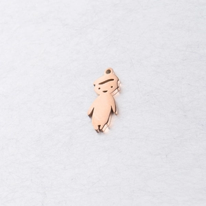 Macro detail of a rose gold boy-shaped mirror stainless steel pendant for jewelry DIY