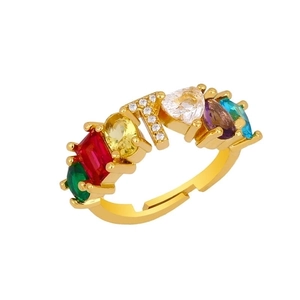 Detailed shot of gold letter Y ring featuring vibrant multi-colored inlaid gemstones