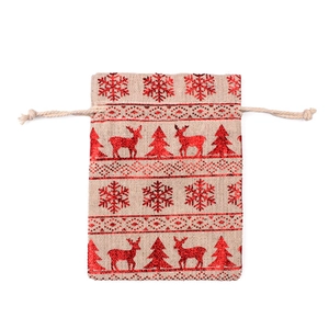Close-up of beige linen Christmas drawstring bag with red glitter reindeer and snowflakes