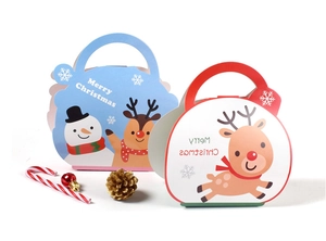 Detailed view of red and blue Christmas gift boxes with snowman and reindeer illustrations