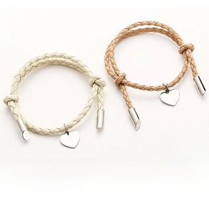 Detail of woven rope bracelets with polished heart-shaped stainless steel pendants