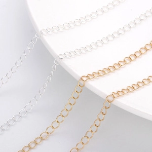 Macro detail of fine gold and silver plated copper chains for DIY jewelry making