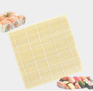 Detailed view of a square bamboo sushi rolling mat with decorative sushi on white background