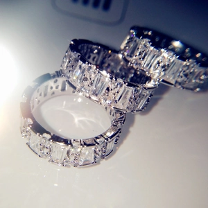 Three sparkling silver stacking rings set with clear baguette and round crystals