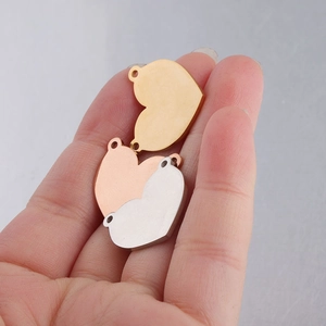 Polished heart shaped stainless steel pendants in gold, rose gold and silver finishes