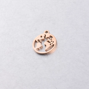 Macro shot of rose gold stainless steel hollow world map pendant with polished finish