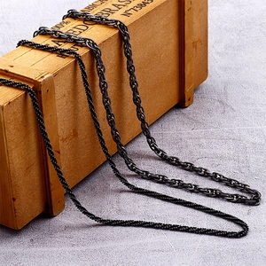Retro titanium steel twist and box chain necklaces displayed on a vintage wooden box