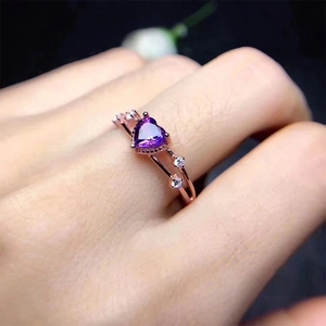Rose gold heart-shaped amethyst ring with micro-pave diamond accents on double bands