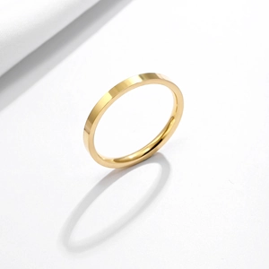 Minimalist golden stainless steel ring with a smooth polished finish and glossy texture