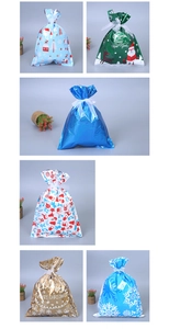 Detail of assorted Christmas drawstring gift bags with reindeer and Santa Claus patterns