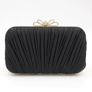 Elegant black pleated evening clutch bag with a golden bow rhinestone clasp for women