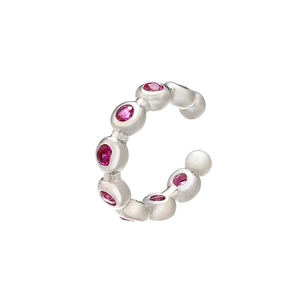 Macro detail of silver ear cuff with micro-inset pink cubic zirconia stones