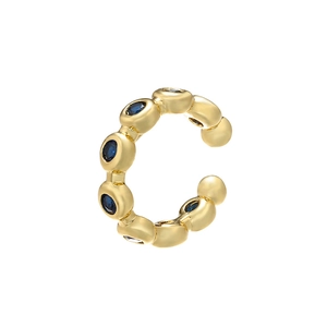Detailed view of C-shaped gold ear cuff featuring pave-set dark blue cubic zirconia stones