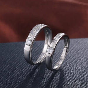 Polished silver couple rings engraved with Forever Love and set with zircon stones