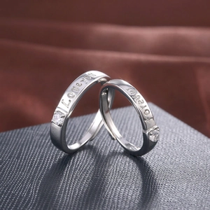 Polished silver couple rings with Forever Love You engraving and single zircon stones