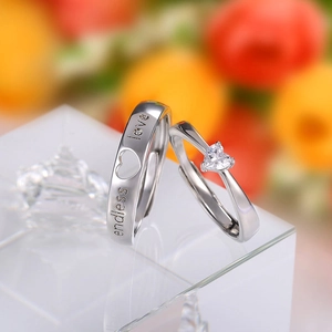 Adjustable silver couple rings with endless love engraving and heart shaped crystal