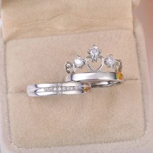 Silver crown couple ring set with sparkling zircons in a soft beige jewelry box