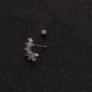Macro shot of a flower zircon cartilage stud with silver stainless steel screw back