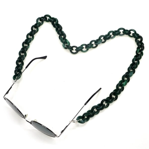 Dark green acrylic chunky eyewear chain shaped into a heart with black sunglasses