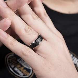 Two-tone black and silver stainless steel ring with frosted grid texture for men