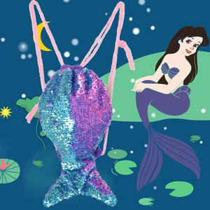 Detail of mermaid tail sequin drawstring bag with blue and purple reversible scales