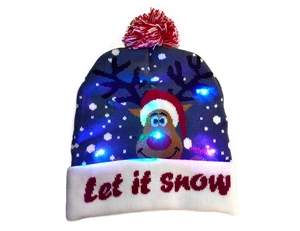 Detail of navy blue knitted Christmas hat with reindeer pattern and LED lights