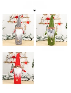 Close-up of gnome Christmas wine bottle covers with felt hats and long faux fur beards