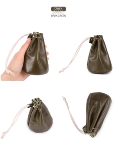 Detail of dark green leather drawstring coin pouch for jewelry and earphone storage