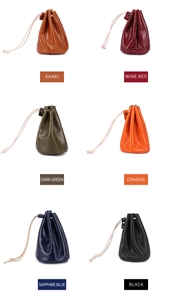 Leather drawstring coin pouches in khaki, wine red, green, orange, blue, and black colors