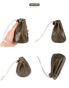 Detail view of dark green oil wax leather drawstring pouch for coins and lipsticks
