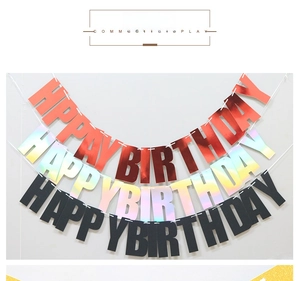 Close-up of Happy Birthday banners in rose gold mirror, laser, and matte black finishes