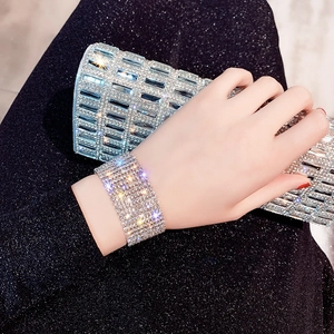 Detailed view of luxury multi-row rhinestone wide bracelet with sparkling silver finish