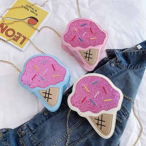 Close-up of three ice cream cone shaped sequin crossbody bags with gold chain straps