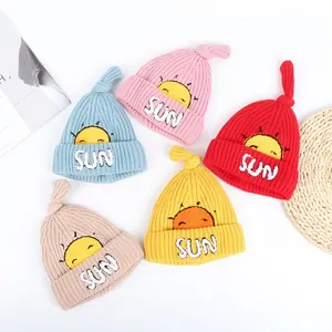 Thick knitted winter beanies for babies with sun embroidery in multiple vibrant colors