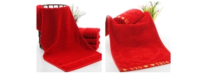 Detail of red wedding towel featuring embossed Xi character and embroidered numbers