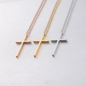 Polished stainless steel cross necklace set in gold, rose gold, and silver finishes