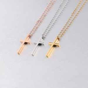 Set of minimalist stainless steel cross necklaces in gold, silver, and rose gold finishes
