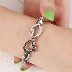 Silver infinity mesh bracelet with forever engraving on a woman's wrist