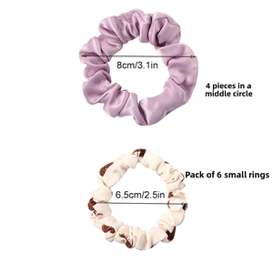 Size comparison of 8cm purple satin scrunchies and 6.5cm floral print hair ties