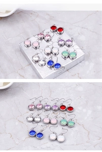Detailed view of colorful round crystal drop earrings in various gemstone colors