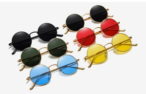Close-up of retro round metal sunglasses in various lens colors with thin frames