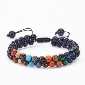 Detail of double-layer woven bracelet with blue goldstone and colorful natural stones