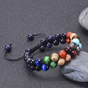 Detail of adjustable double-layer natural stone beaded bracelet with woven cord