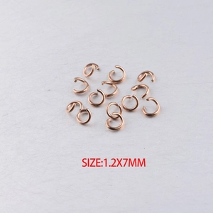 Macro detail of 1.2x7mm rose gold open jump rings for DIY jewelry making accessories