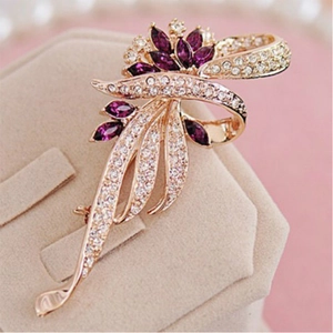 Exquisite purple bauhinia flower brooch with gold tassels and crystal zircons on a pink base
