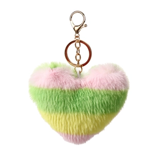 Detail of multi-colored heart faux fur keychain with golden clasp and soft fluffy texture
