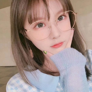 Detail view of thin gold metal frame glasses with soft silicone nose pads on model