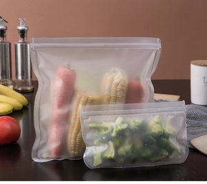 Reusable food-grade EVA storage bags filled with fresh vegetables in a kitchen setting