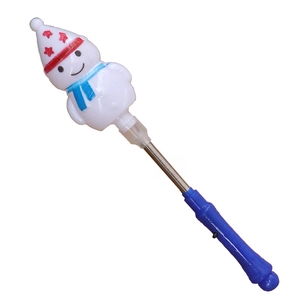 Close-up of a glowing snowman spring wand with a blue handle and festive details
