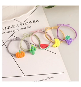 Detail view of 5-piece cute fruit hair scrunchies set with 3D soft rubber charms